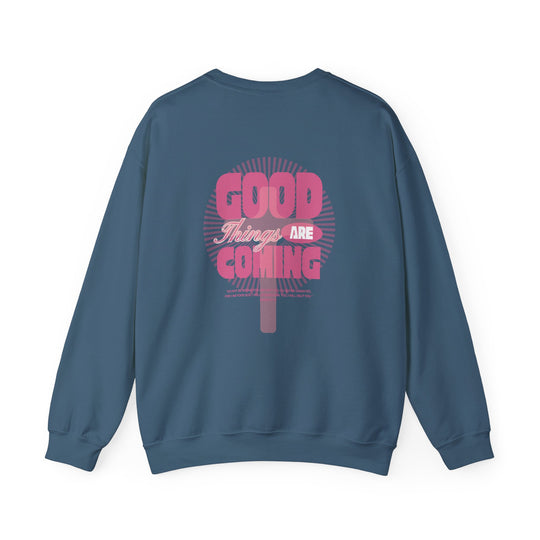 Good Things are Coming Crew: Unisex crewneck sweatshirt made from a comfy polyester-cotton blend, featuring ribbed collar and durable double-needle stitching for a cozy fit.