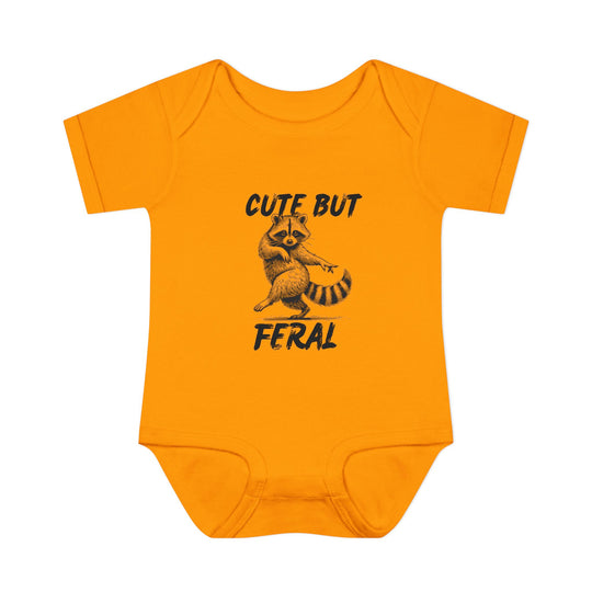 Orange onesie with Cute But Feral slogan and a raccoon sketch, designed for infants with soft, 100% ring-spun cotton. Unisex fit with lap shoulders.