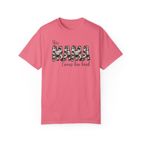 A relaxed fit Mama Herd Tee in pink with black text. 100% ring-spun cotton, garment-dyed for extra coziness. Double-needle stitching for durability, no side-seams for a tubular shape. Sizes S-4XL.