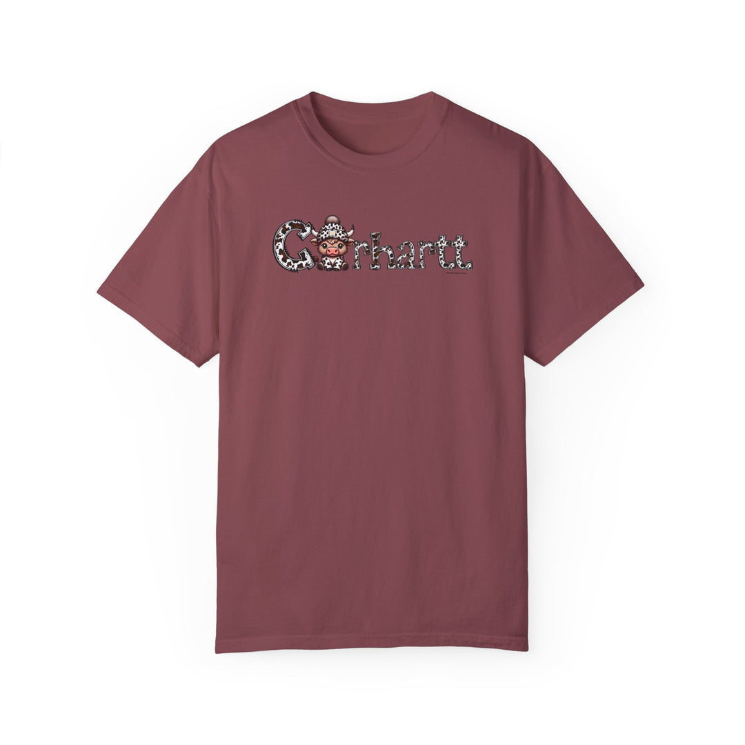 A maroon Cowhartt Cow Tee, featuring a cartoon cow with a hat and horns. 100% ring-spun cotton, medium weight, relaxed fit, durable double-needle stitching, and seamless design for comfort.