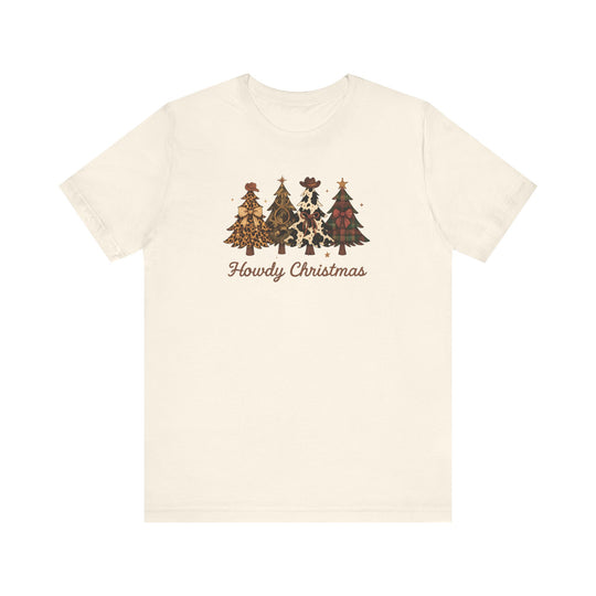 Cream-colored Howdy Christmas tee featuring four stylized Christmas trees with western motifs and cowboy hats. Unisex fit, soft cotton, and durable design.