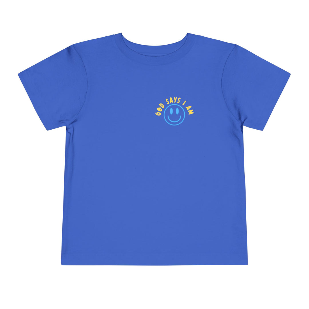 Toddler T-shirt featuring a cheerful God Says I Am graphic with a smiley face on the chest, crafted from soft, 100% cotton for everyday comfort.