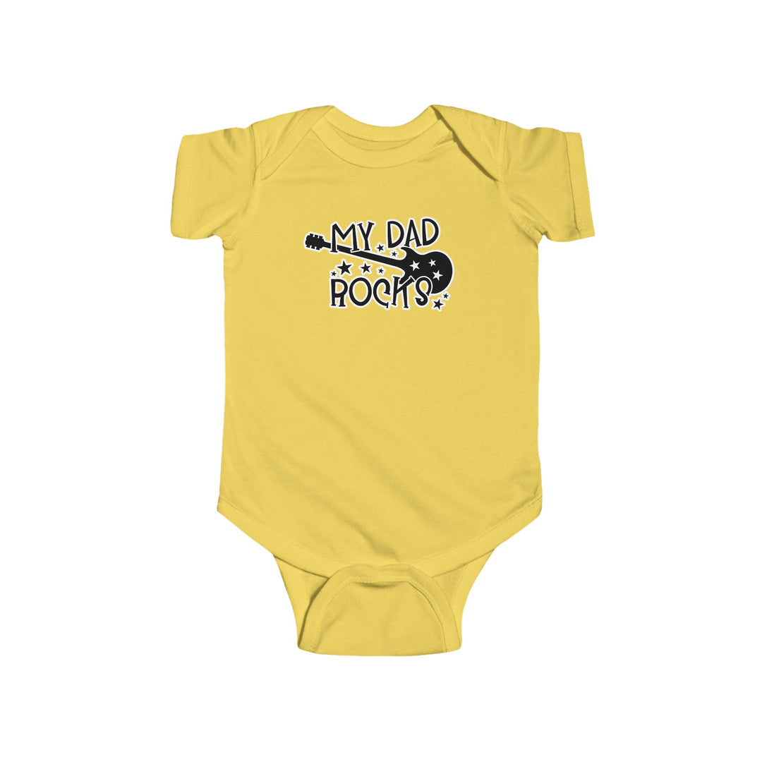 A yellow baby bodysuit featuring a guitar and text, ideal for little rockstars. Made of 100% cotton, with ribbed knitting for durability and plastic snaps for easy changing. From Worlds Worst Tees, known for unique graphic tees.
