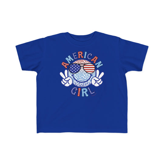 American Girl Toddler Tee featuring a blue shirt with a cartoon character and logo. Soft 100% combed ringspun cotton, light fabric, tear-away label, classic fit. Sizes: 2T, 3T, 4T, 5-6T.