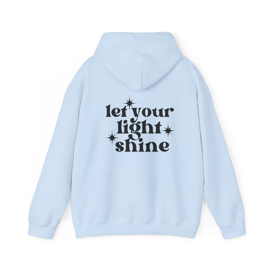 A cozy unisex Let Your Light Shine Hoodie in light blue with black text. Thick cotton-polyester blend, kangaroo pocket, and matching drawstring. Perfect for chilly days. Classic fit, tear-away label, true to size.