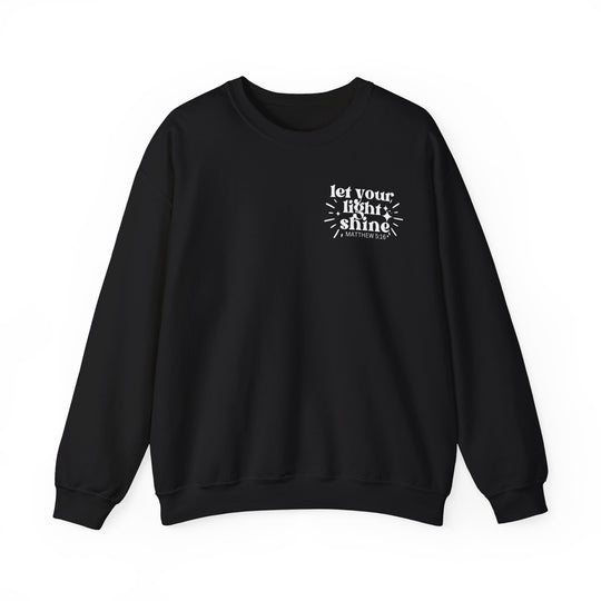 A black crewneck sweatshirt with white text, ideal for comfort and style. Unisex heavy blend, 50% cotton 50% polyester, ribbed knit collar, no itchy side seams. Let Your Light Shine Crew.