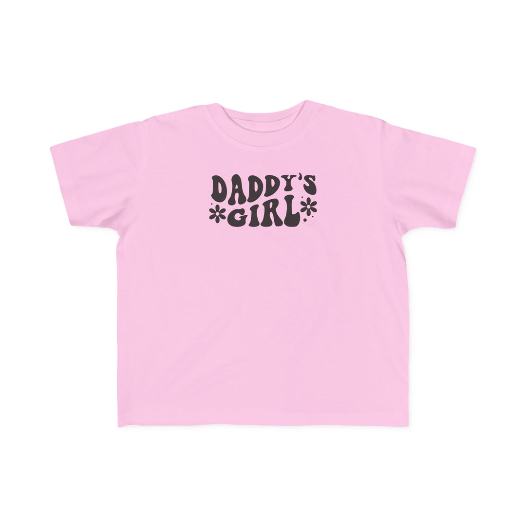 A Daddy's Girl Toddler Tee in pink with black text, ideal for sensitive skin. Made of 100% combed ringspun cotton, light fabric, classic fit, tear-away label, and true-to-size. Perfect for first ventures.