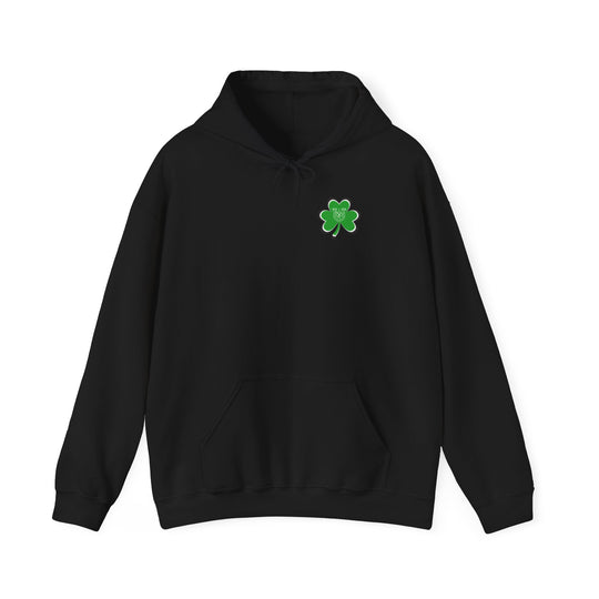 A black Lucky Lucky Lucky Hoodie with a green clover patch and horseshoe detail. Unisex heavy blend, cotton-polyester fabric for warmth and comfort. Kangaroo pocket and matching drawstring for style and practicality.