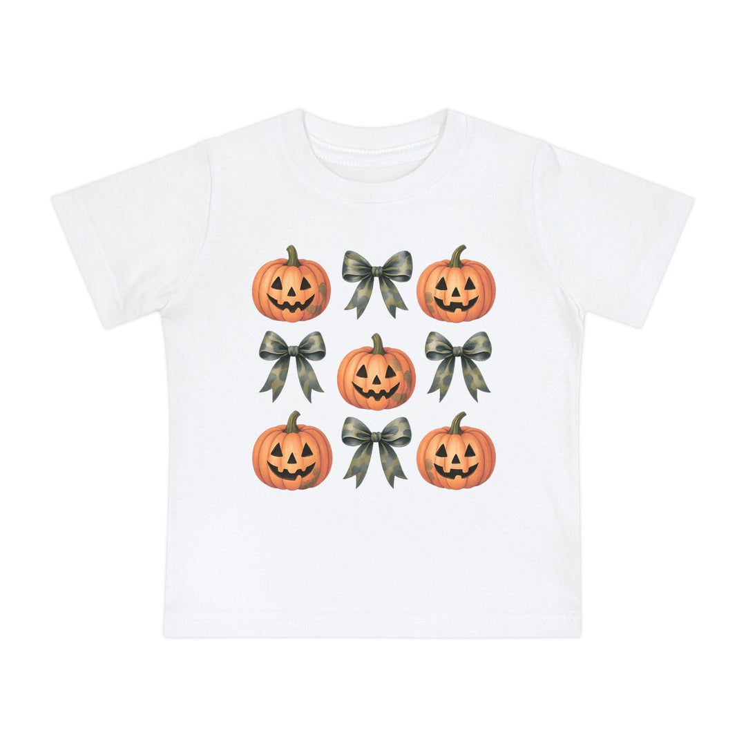 Pumpkins and Bows Baby Tee featuring a 3x3 grid of jack-o’-lanterns and camouflage-pattern bows, emphasizing a soft, durable design for infants.