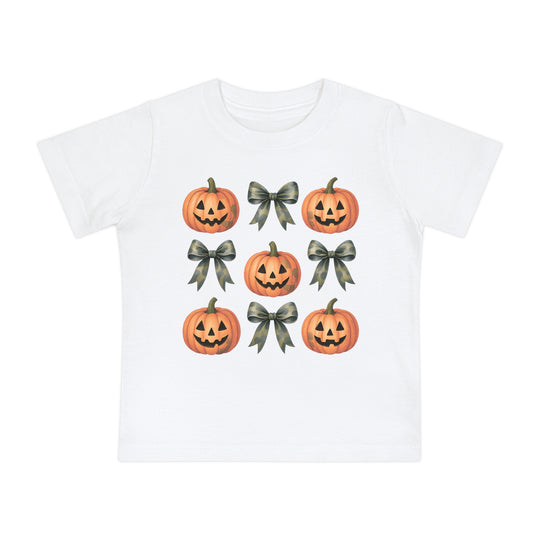 Pumpkins and Bows Baby Tee featuring a 3x3 grid of jack-o’-lanterns and camouflage-pattern bows, emphasizing a soft, durable design for infants.