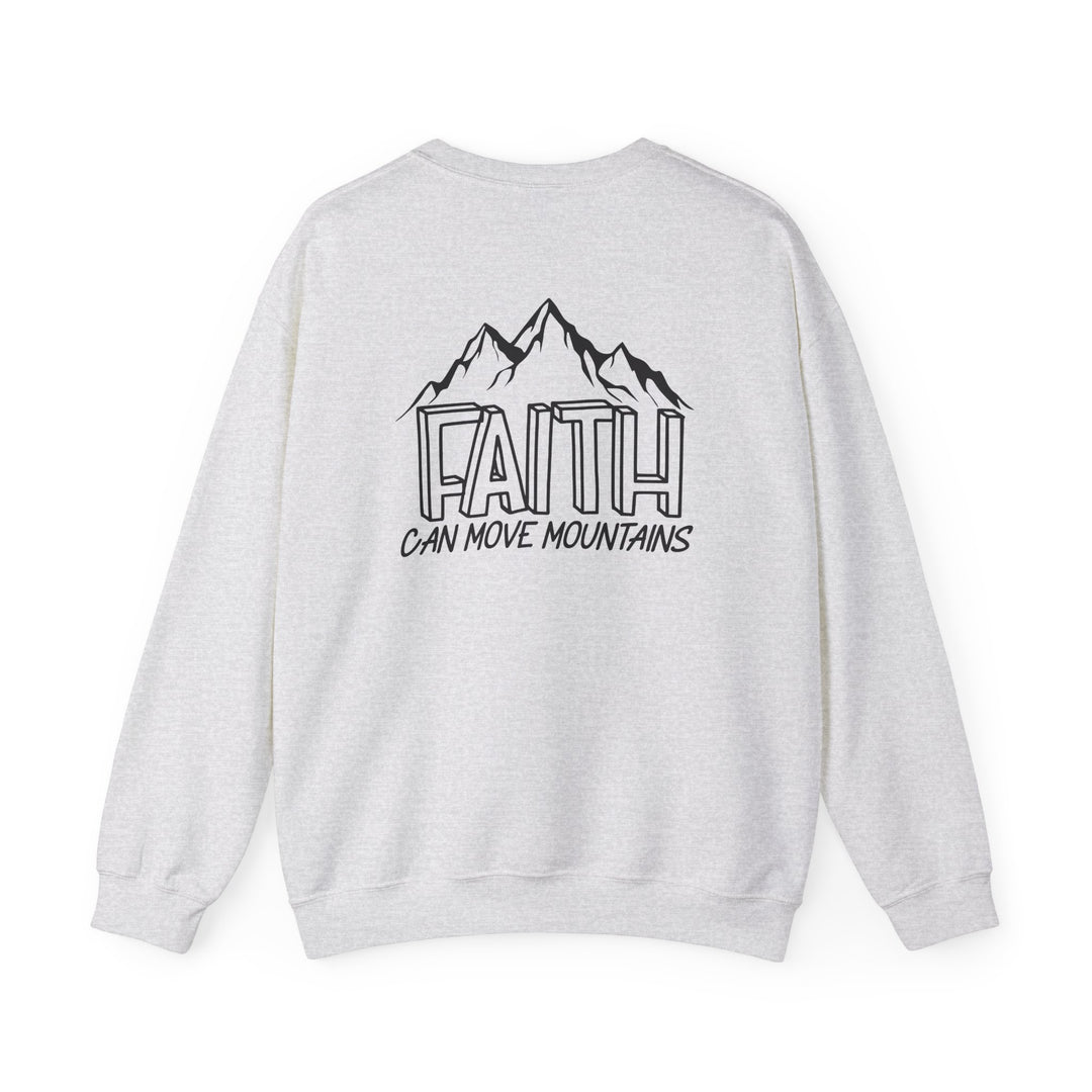 A white crewneck sweatshirt featuring a black and white mountain design, embodying the Faith Can Move Mountains Crew theme. Unisex, heavy blend fabric for comfort, ribbed knit collar, and durable double-needle stitching. Made from 50% cotton, 50% polyester blend.
