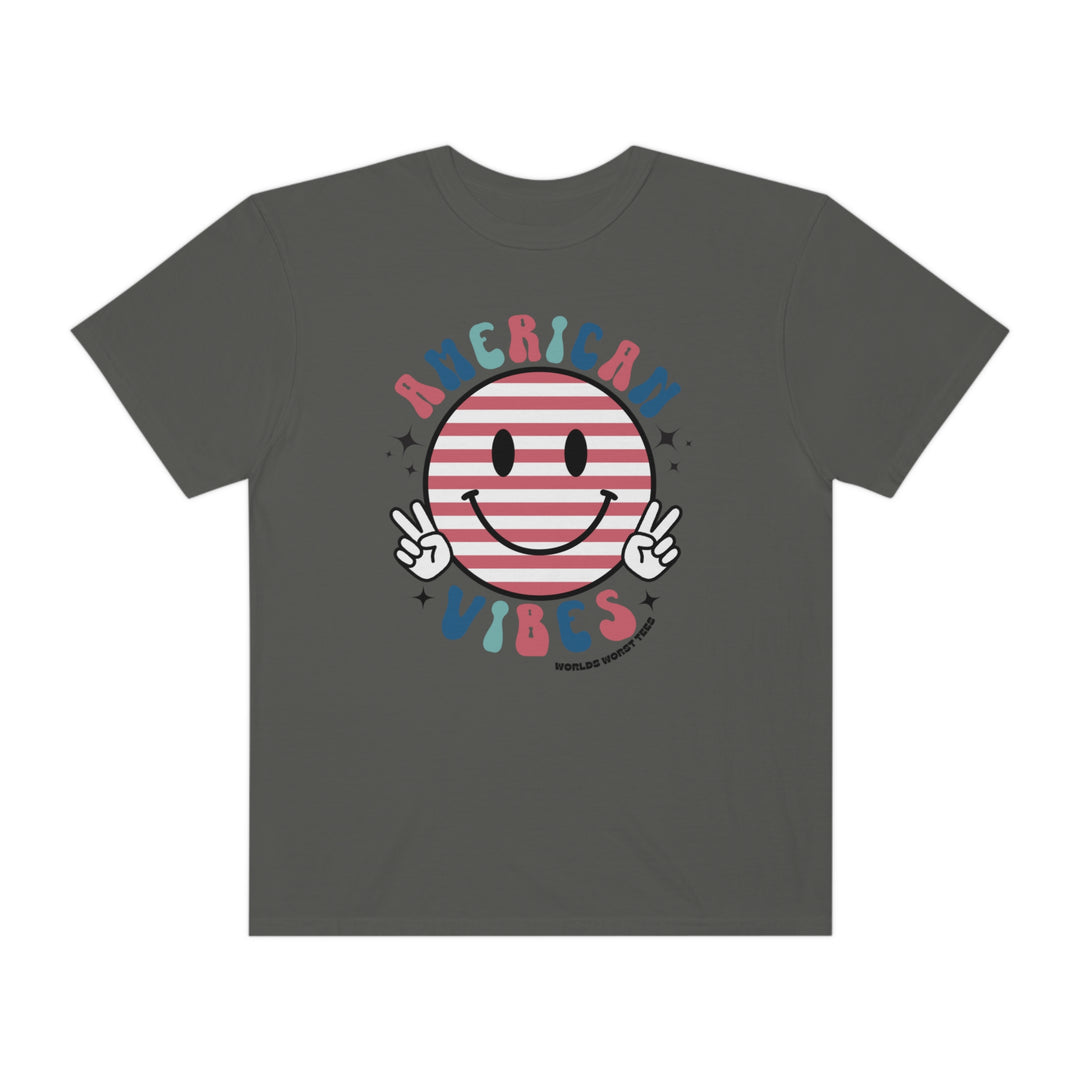 American Vibes Tee: Grey shirt with smiley face and peace signs. 100% ring-spun cotton, garment-dyed for extra coziness. Relaxed fit, durable double-needle stitching, tubular shape. Ideal for daily wear.
