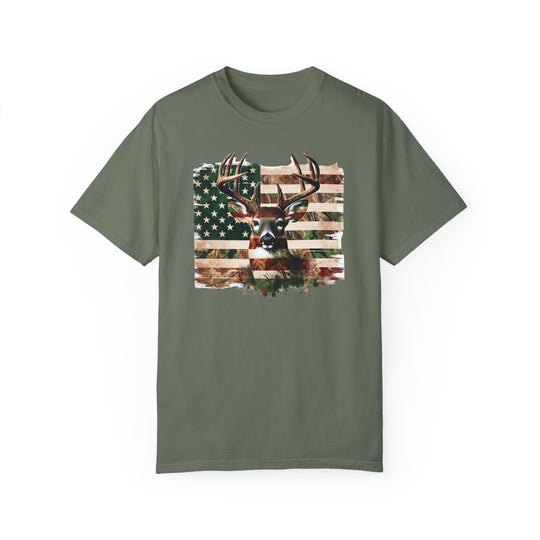 A relaxed fit Deer Flag Tee, crafted from 100% ring-spun cotton. Garment-dyed for extra coziness, featuring a deer and flag design. Durable double-needle stitching, tubular shape with no side-seams.