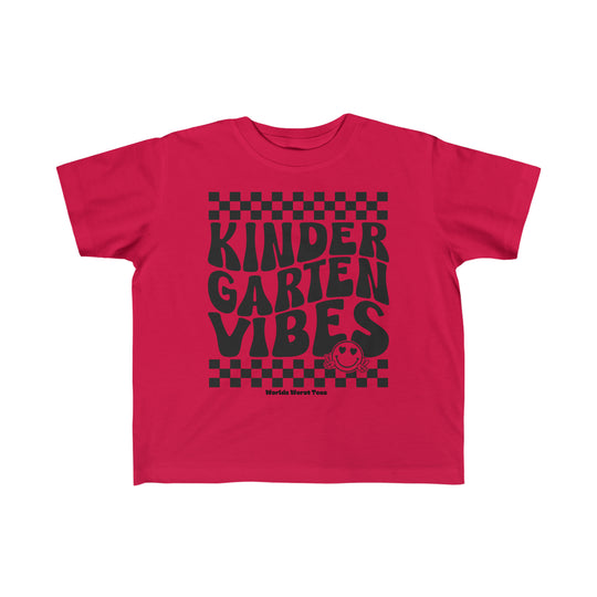 Kindergarten Vibes Toddler Tee featuring red shirt with black text, perfect for sensitive skin. 100% combed ringspun cotton, light fabric, classic fit, tear-away label, true to size. Ideal for first ventures.