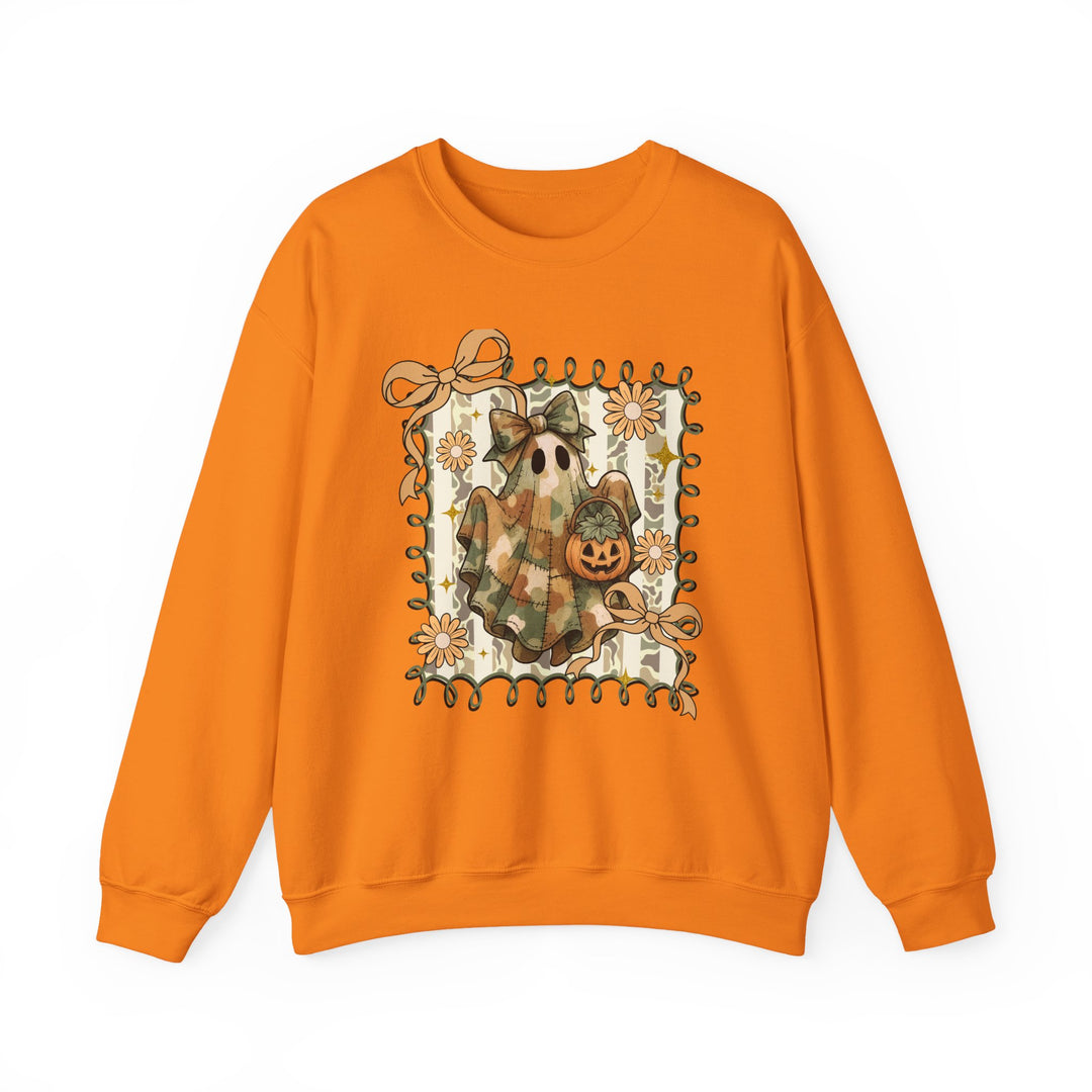 Orange crewneck sweatshirt featuring a Quilted Ghost graphic with a patchwork ghost, jack-o-lantern, daisies, and bows, ideal for cozy, stylish Halloween wear.
