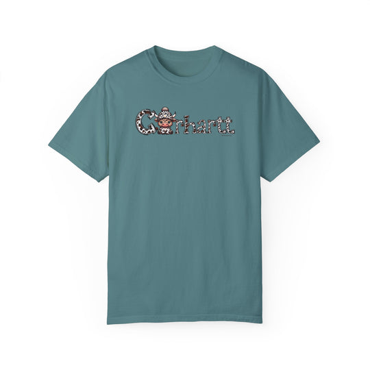 Blue Cowhartt Cow Tee, a ring-spun cotton t-shirt with a cartoon cow design. Garment-dyed for extra coziness, featuring double-needle stitching for durability and a relaxed fit. From Worlds Worst Tees.