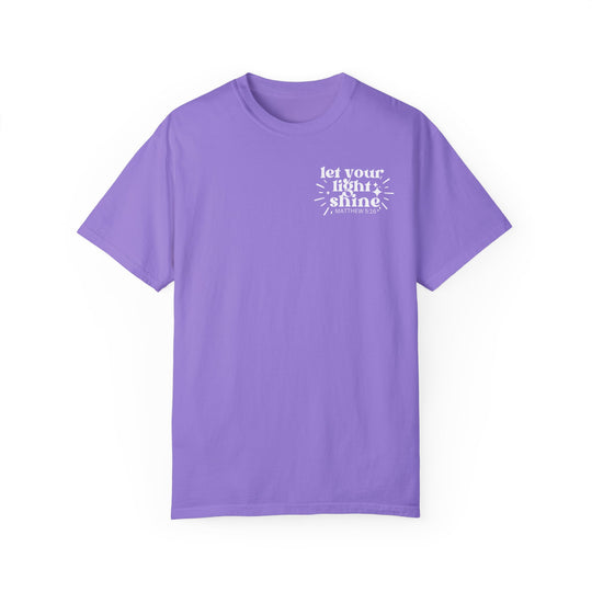 Let Your Light Shine Tee: A purple t-shirt with white text, 100% ring-spun cotton, medium weight, relaxed fit, durable double-needle stitching, no side-seams for tubular shape. From Worlds Worst Tees.