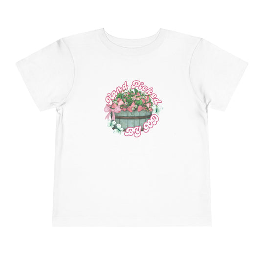 Hand Picked by GOD Toddler Tee features a soft, comfortable fit with a tear-away label, made from 100% Airlume combed and ring-spun cotton for toddlers.