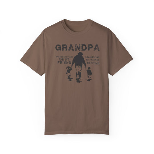 A brown Grandpa and Grandkids Tee featuring a man and a child, made of 100% ring-spun cotton. Soft-washed, garment-dyed fabric with a relaxed fit, double-needle stitching, and seamless design for durability and comfort.