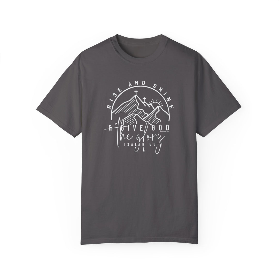 A grey Rise and Shine Tee, featuring white text, a cross, and mountains. Made of 100% ring-spun cotton for coziness, with double-needle stitching for durability and a relaxed fit for daily wear.
