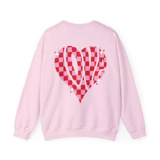 Unisex Love Crew sweatshirt: Pink sweater with heart design. Cotton-polyester blend for comfort. Ribbed knit collar, no itchy seams. Medium-heavy fabric, loose fit, sewn-in label. Sizes S-5XL.