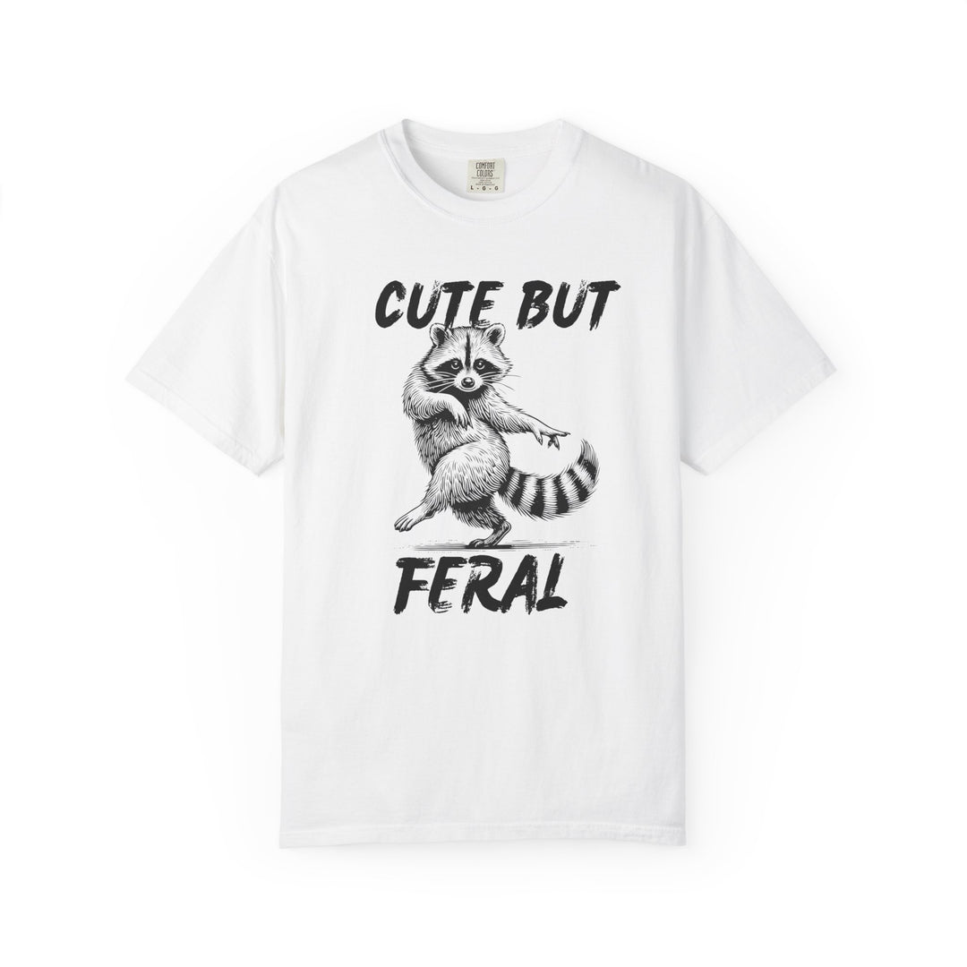 Cute but Feral Tee featuring a raccoon illustration with slogan, made from soft, durable ring-spun cotton, offering a relaxed fit for everyday wear.