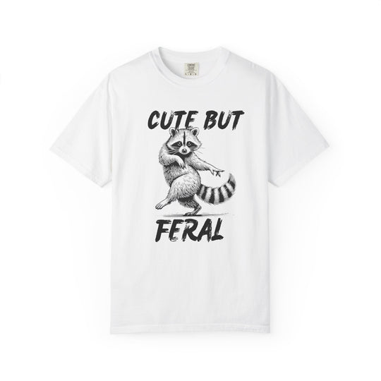 Cute but Feral Tee featuring a raccoon illustration with slogan, made from soft, durable ring-spun cotton, offering a relaxed fit for everyday wear.