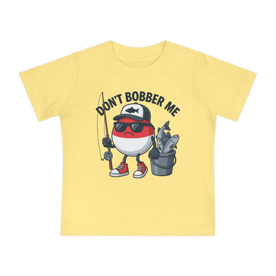 Copy of Don't Bobber Me Baby Tee featuring a cartoon fishing bobber character with a fly-rod and bucket, offering a humorous design for infant style and comfort.