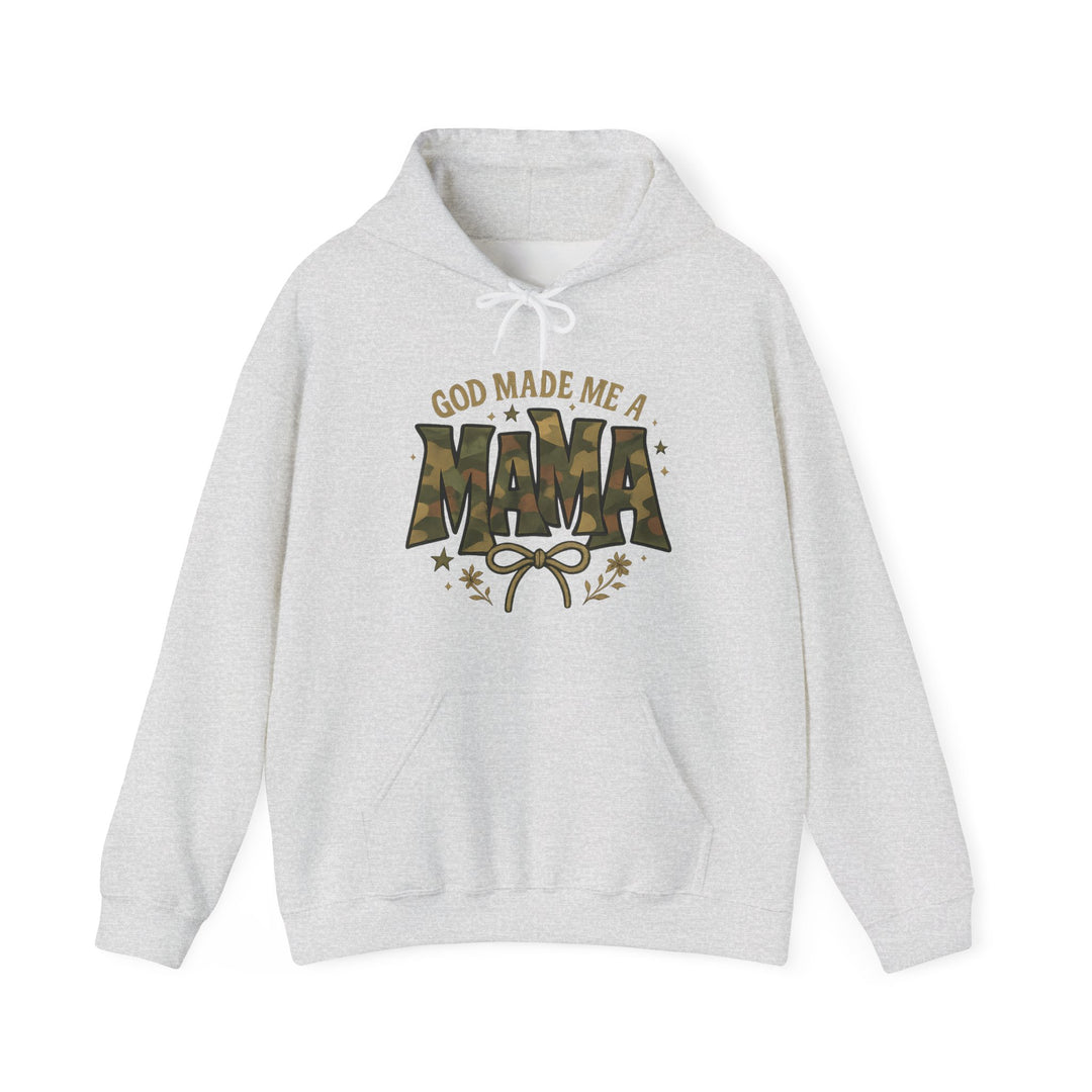 God Made Me a Mama Hoodie with camouflage MAMA graphic, bow, foliage accents, kangaroo pocket, and drawstring hood, offering warmth and comfort.