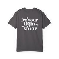 A relaxed fit Let Your Light Shine Tee, a grey t-shirt with white text, crafted from 100% ring-spun cotton. Double-needle stitching for durability, no side-seams for a tubular shape. Sizes S to 3XL.
