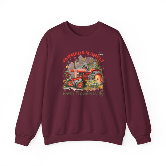 A comfortable unisex heavy blend crewneck sweatshirt featuring a tractor design and fresh flowers. Made of 50% cotton and 50% polyester, with ribbed knit collar and no itchy side seams. Ideal for casual wear.