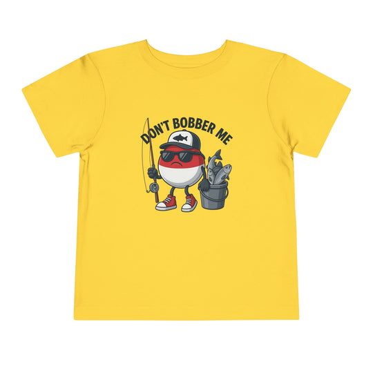 Don't Bobber Me Toddler Tee featuring a fishing bobber character with sunglasses and gear, holding a fishing rod, perfect for playful, unique kids' wardrobes.