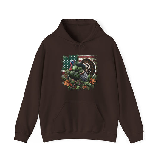 A brown Turkey Hunting Hoodie, a cozy blend of cotton and polyester, featuring a turkey design on the front. Unisex, with a kangaroo pocket and drawstring hood. Medium-heavy fabric, tear-away label, true to size.