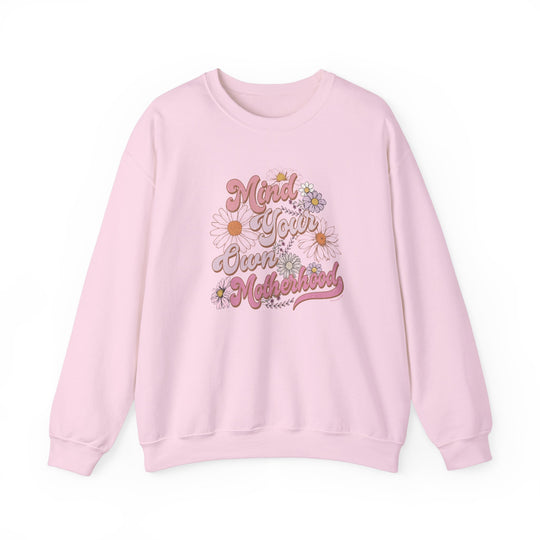 A pink Mind Your Own Motherhood Crew unisex sweatshirt with ribbed knit collar, no itchy side seams, 50% cotton, 50% polyester blend, medium-heavy fabric, loose fit, true to size.