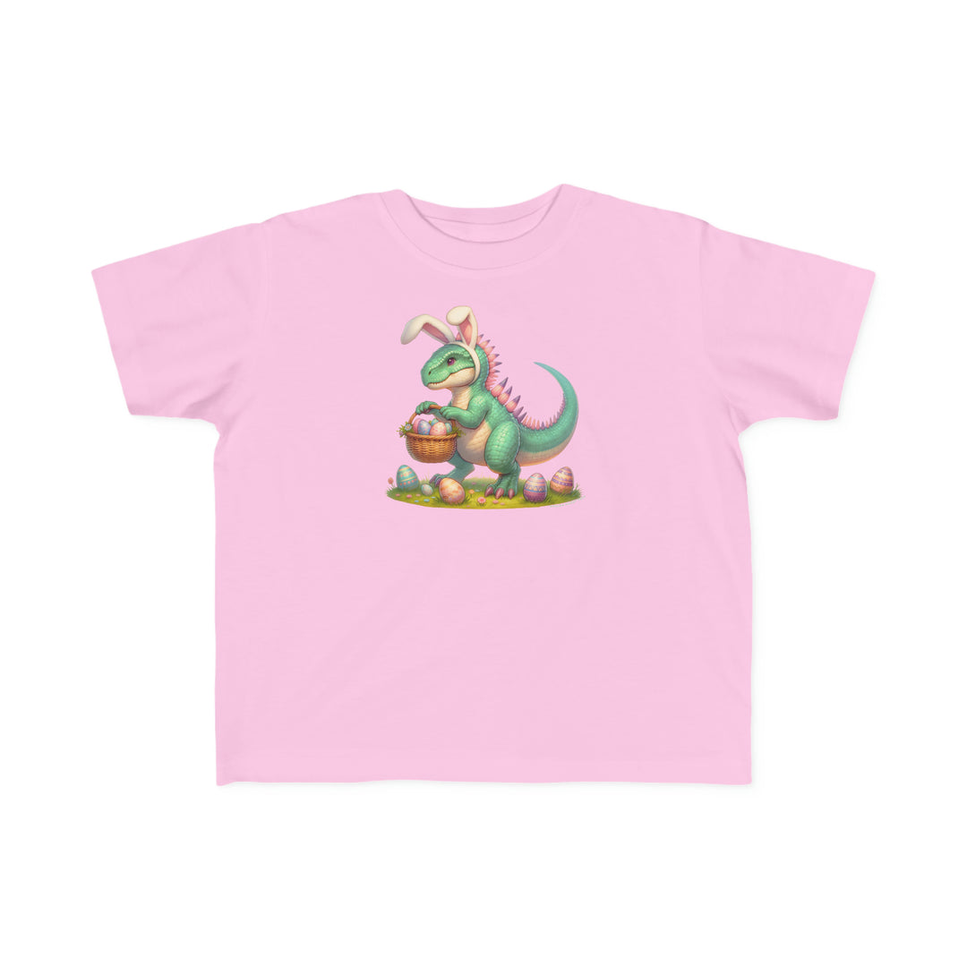 Eggosaurus Toddler Tee featuring a cartoon dinosaur holding a basket of eggs. Soft, durable 100% combed ringspun cotton, light fabric, classic fit, tear-away label, perfect for sensitive skin.