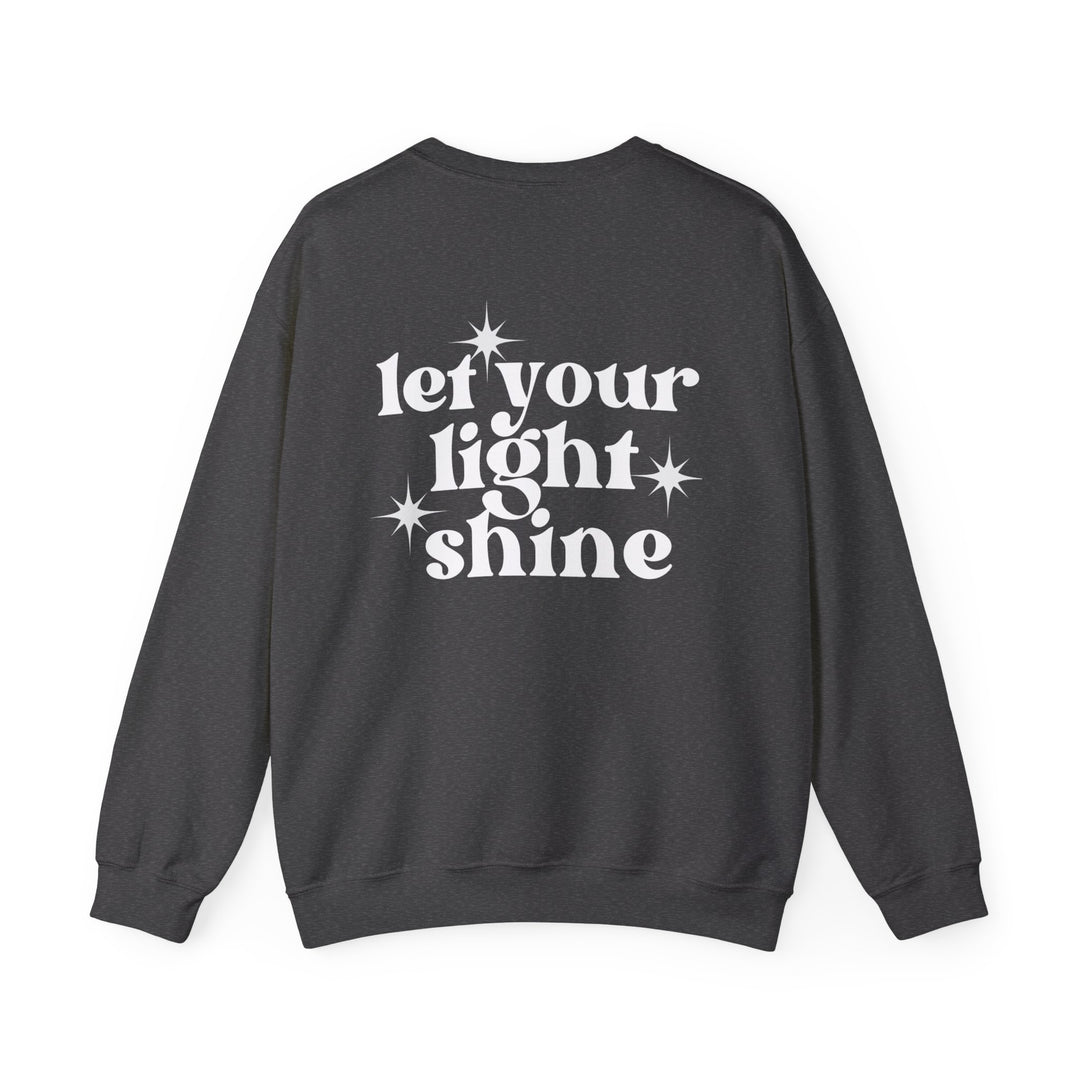 Unisex heavy blend crewneck sweatshirt featuring Let Your Light Shine design. Ribbed knit collar, no itchy side seams. 50% Cotton 50% Polyester, medium-heavy fabric, loose fit, true to size. Dimensions: Width, Length, Sleeve length.