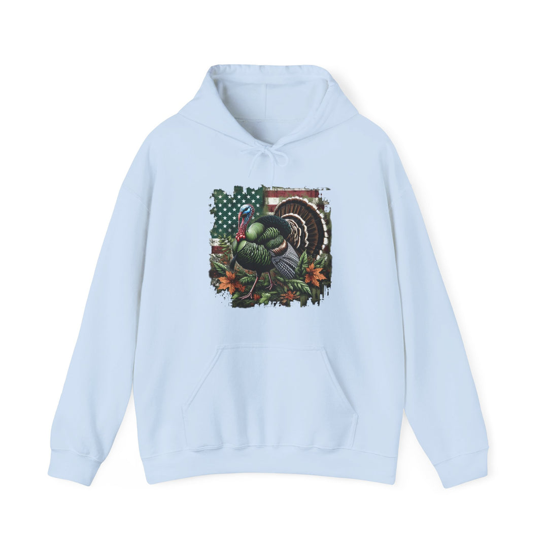 A blue hoodie featuring a turkey design, perfect for turkey hunting enthusiasts. Unisex heavy blend for comfort, cotton-polyester mix, kangaroo pocket, and drawstring hood. Ideal for warmth and style.
