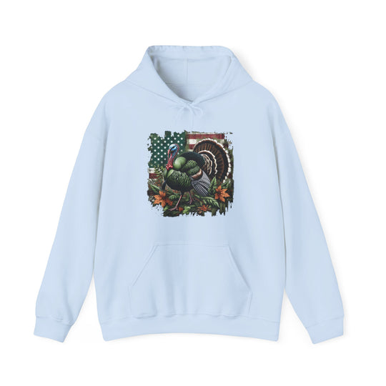 A blue hoodie featuring a turkey design, perfect for turkey hunting enthusiasts. Unisex heavy blend for comfort, cotton-polyester mix, kangaroo pocket, and drawstring hood. Ideal for warmth and style.