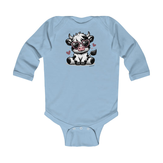 A cute cow-themed long sleeve onesie for infants, featuring a cartoon cow wearing sunglasses. Made of soft 100% cotton, with ribbed bindings for durability and plastic snaps for easy changing. From Worlds Worst Tees.
