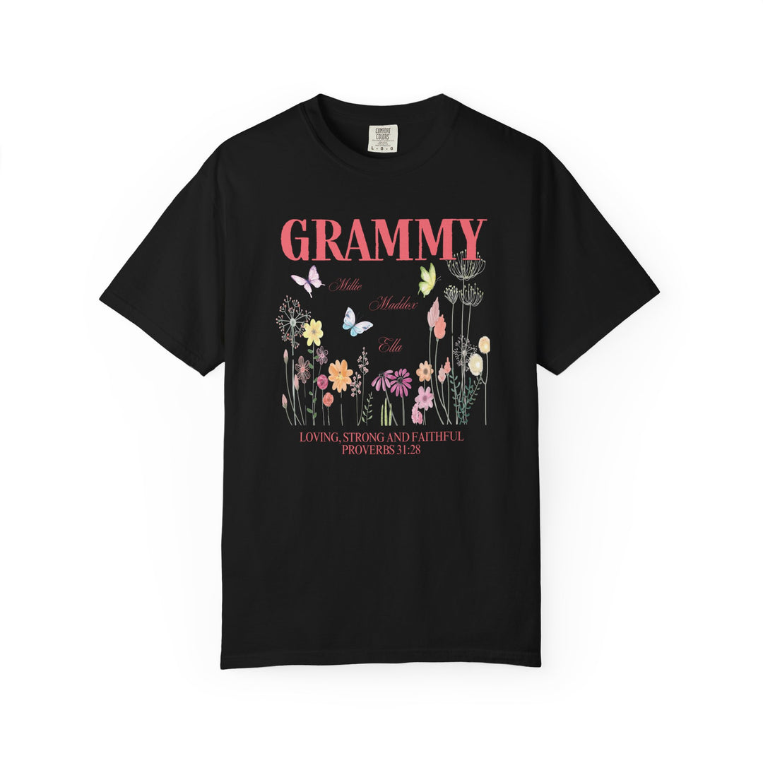 Grammy Tee featuring a black shirt adorned with vibrant flowers and butterflies, highlighting its unique graphic design and relaxed fit.