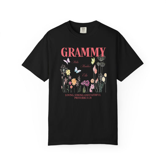 Grammy Tee featuring a black shirt adorned with vibrant flowers and butterflies, highlighting its unique graphic design and relaxed fit.