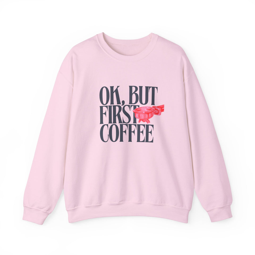 Unisex crewneck sweatshirt, 'Ok But First Coffee' design, showcasing a durable, comfy fit with ribbed collar, ideal for colder months and perfect for custom embroidery.