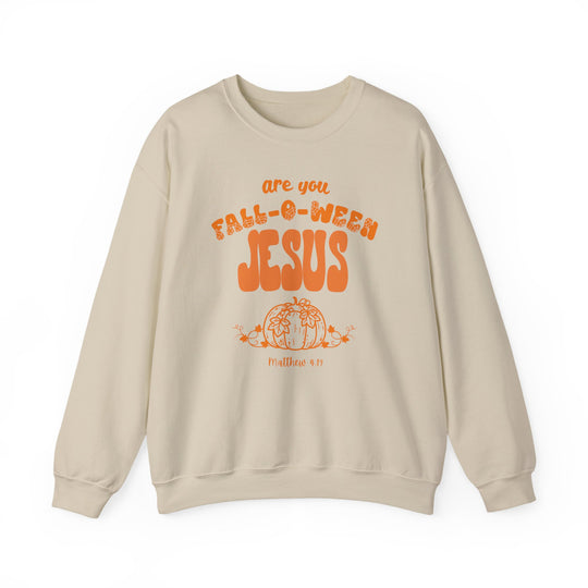 Light-beige crewneck sweatshirt with FALL-O-WEEN JESUS and a pumpkin graphic, referencing Matthew 4:19, in bright orange. Cozy, durable, ideal for fall weather.