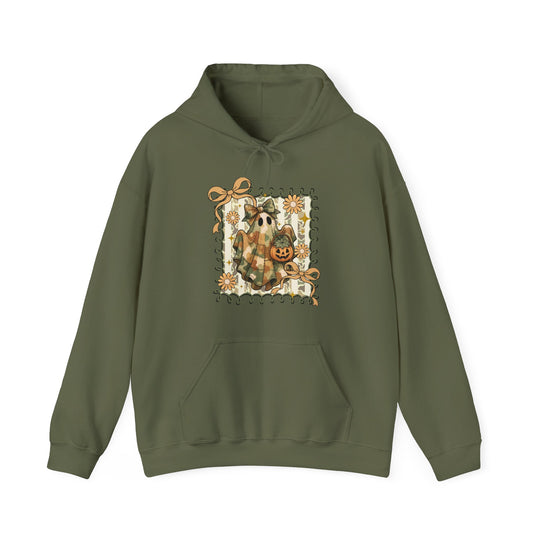 Quilted Ghost Hoodie features a cute ghost in plaid with a jack-o’-lantern, framed by daisies and bows, on an olive-green background.