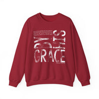 Maroon crew-neck sweatshirt with By His Grace and Romans 3:23-24 scripture in distressed white font, offering comfort and style.
