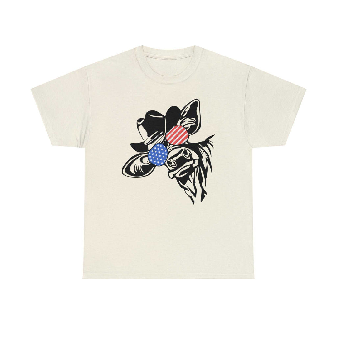 A white t-shirt featuring a cow with a hat and sunglasses, part of the 4th of July Family Dude Cow Tee collection. Unisex heavy cotton tee with ribbed knit collar, tape shoulders, and no side seams.