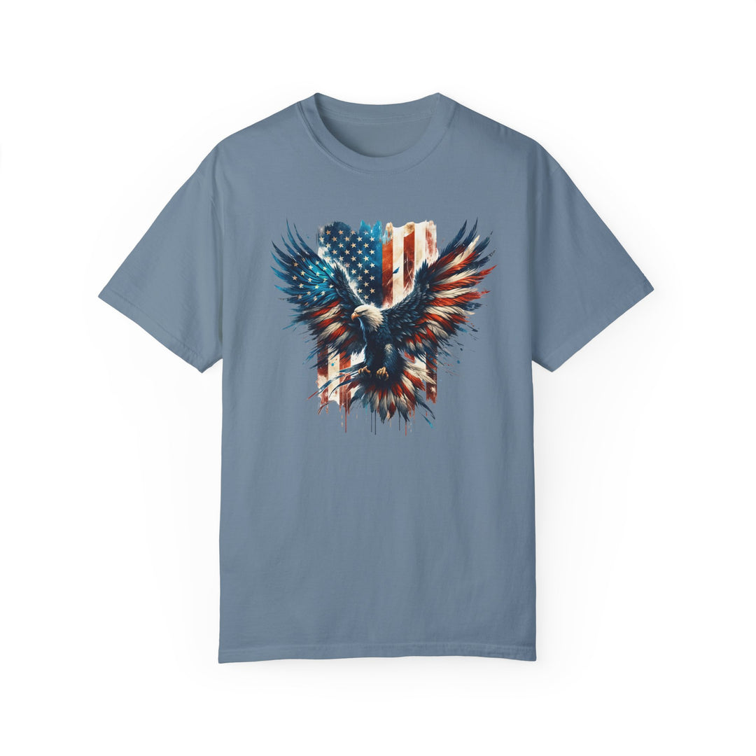 A relaxed fit American Eagle Tee, featuring a bold eagle and flag graphic on soft ring-spun cotton. Garment-dyed for extra coziness, with durable double-needle stitching and a seamless design for a tubular shape.