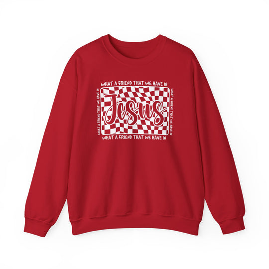 Red crewneck sweatshirt with What a Friend We Have in Jesus graphic, featuring bold Jesus text on a wavy checkerboard. Christian-themed, cozy cotton-polyester blend.