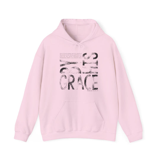 Light pink hoodie with God's GRACE distressed graphic, Bible verse Romans 3:23-24, kangaroo pocket, cozy blend fabric, suitable for cold days.