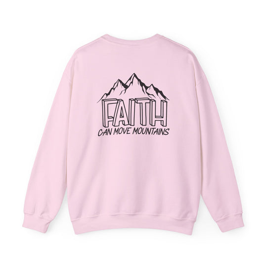 Unisex Faith Can Move Mountains Crew sweatshirt in pink with a mountain graphic. Heavy blend fabric for comfort, ribbed knit collar, and durable double-needle stitching. Ethically made from 50% cotton, 50% polyester.